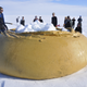 Hot water drilling requires the team to melt snow in large rubber tanks.